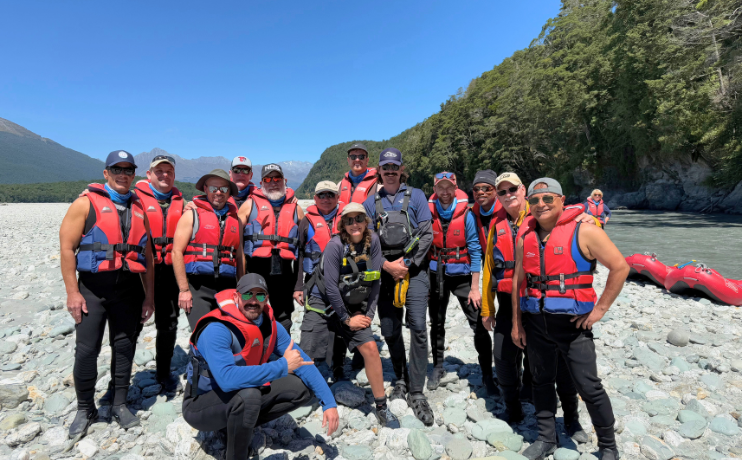 Pivot Trip small-group New Zealand tour for gay men — in life jackets in Mount Aspiring National Park Funyaks