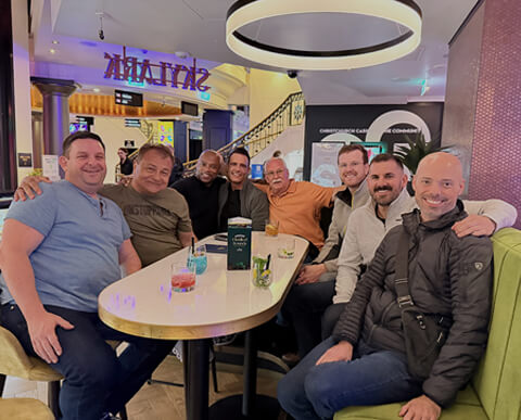 Men enjoying a dinner on a Pivot Trip