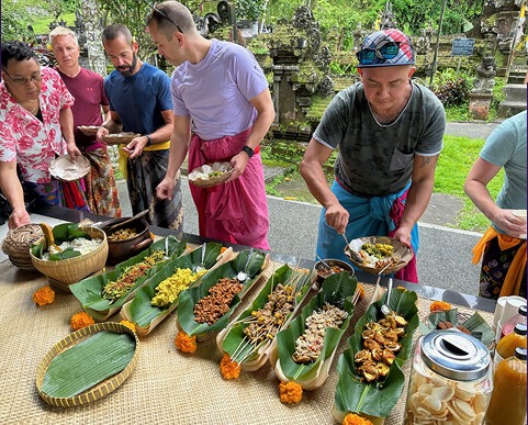 Experiencing traditional food in Bali on a Pivot Trip, gay travel adventure for gay men