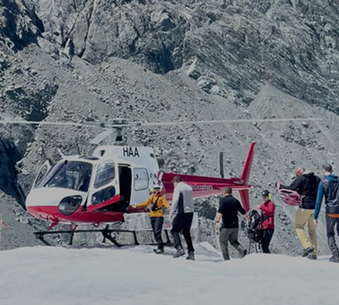 Pivot Trip - gay travel adventure for gay men - men board helicopter