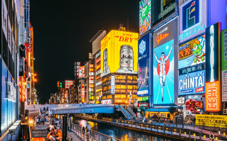 Osaka neon-lit streets at night | Pivot Trip Japan gay tour | LGBTQ+ nightlife and food culture