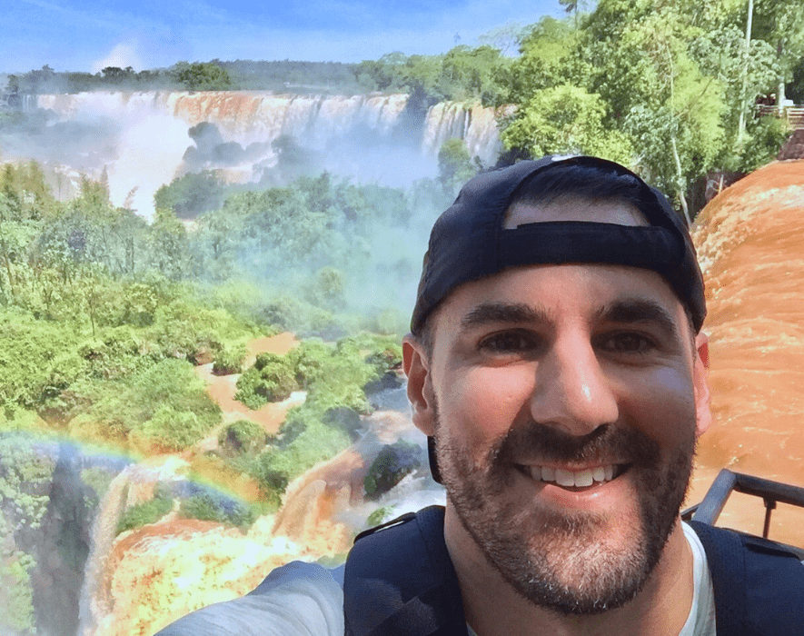 Cory Calvin at Iguazu Falls Argentina Pivot Trip gay traveler
