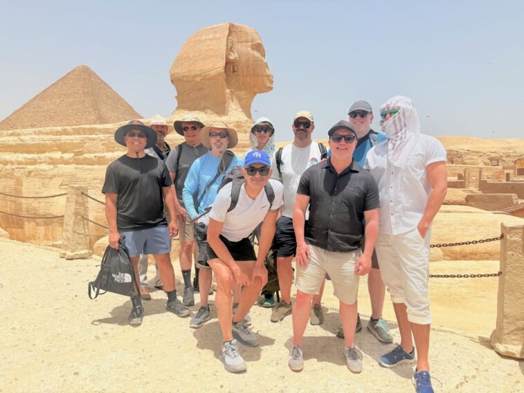 Gay men in front of Sphinx in Giza Plaza, Cairo, on gay group tour of Egypt with Pivot Trip