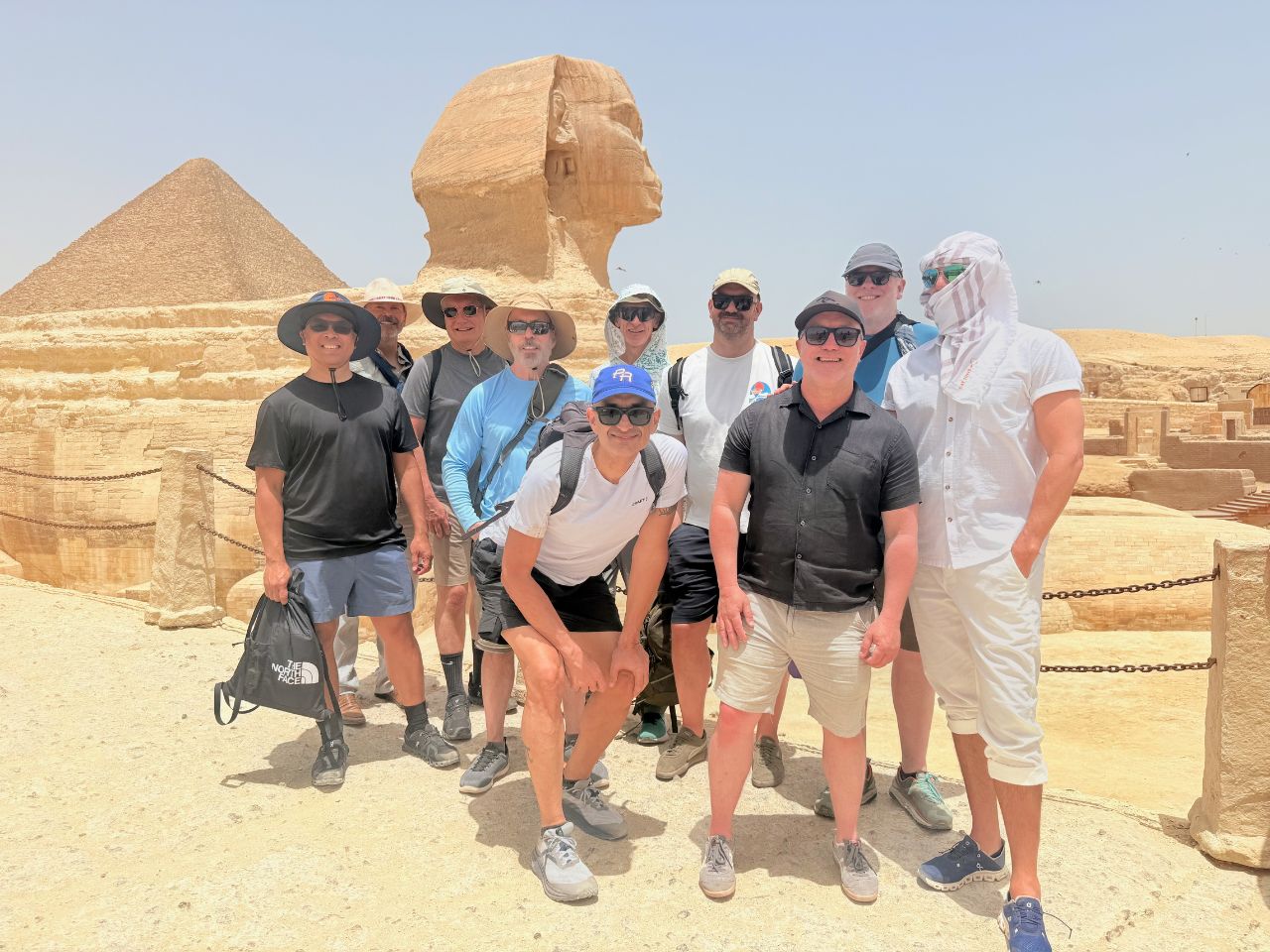 Gay men in front of Sphinx in Giza Plaza, Cairo, on gay group tour of Egypt with Pivot Trip