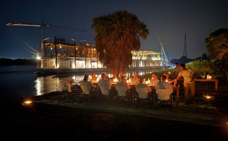 Private luxury boat on Nile for gay group tour in Egypt - private dinner on banks of Nile River