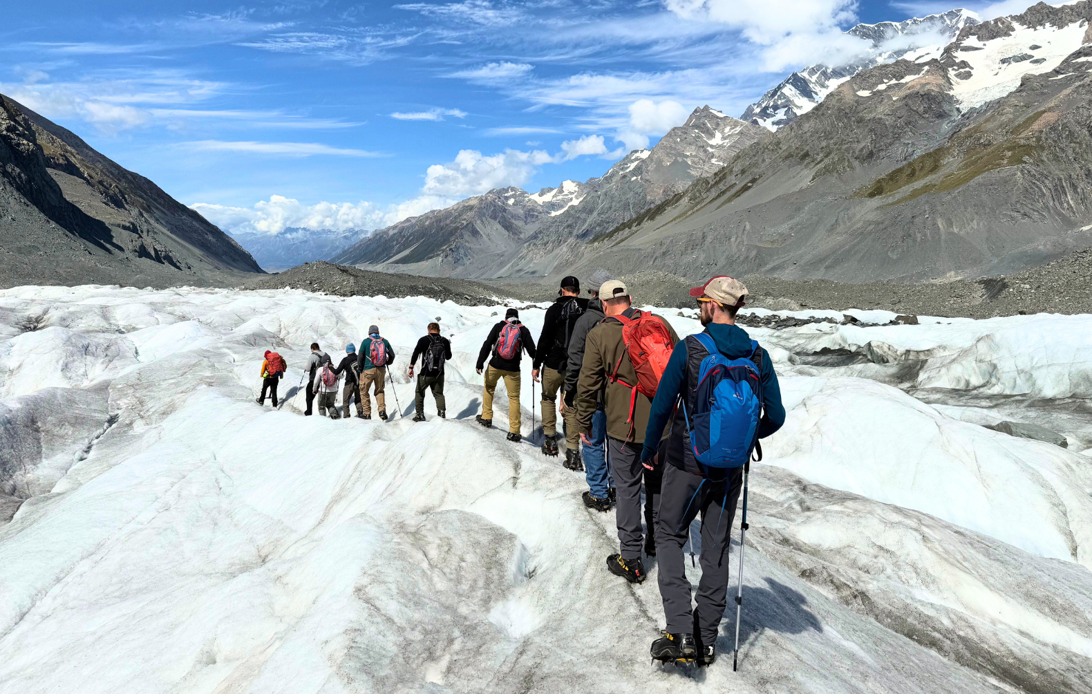 Pivot Trip small-group New Zealand tour for gay men — hiking the Tasman Glacier at Aoraki/Mount Cook